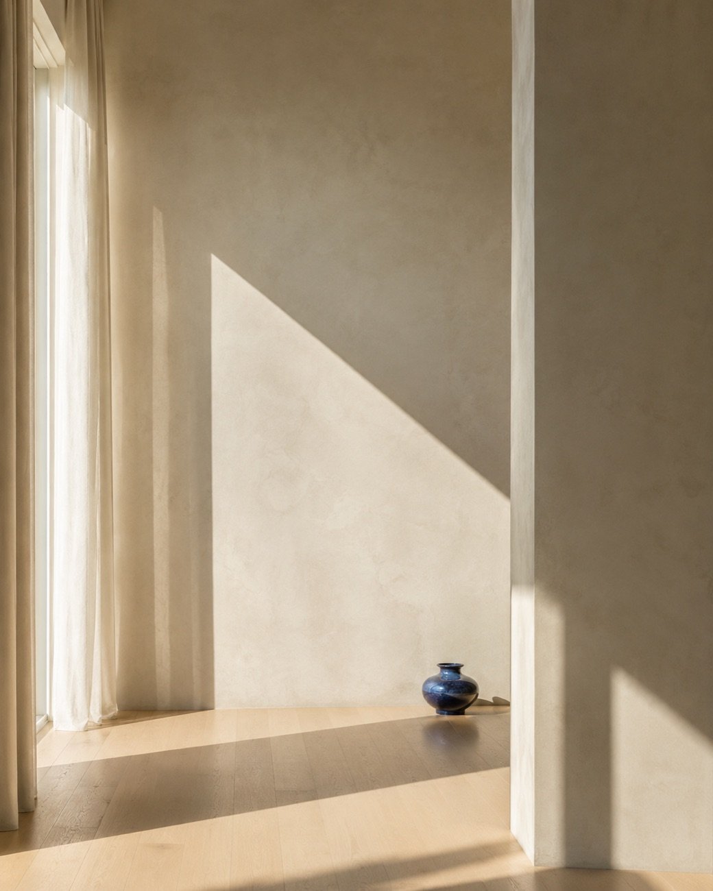 Sunlight across a warm interior with a single blue accent